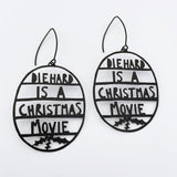 Die Hard is a Christmas Movie earrings in Black