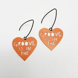 Mini Groove is in the Heart earrings in Orange